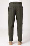 Man wearing military green pants with adjustable strap and pockets, rear view