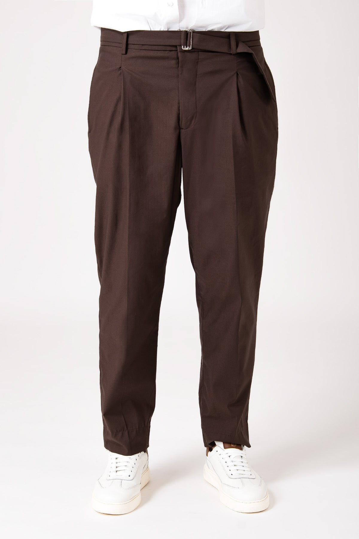 Man wearing dark brown pants with belt and pence front view