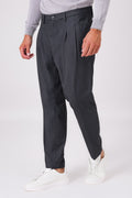Smoke grey double-pleated trousers on a model, front view