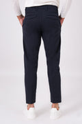 Rear view of blue stretch cotton trousers on a model