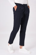 Blue pleated stretch-cotton trousers on a model, front view