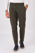 Front view of military green stretch cotton pleated trousers on a model