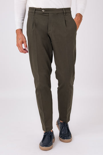 Front view of military green stretch cotton pleated trousers on a model