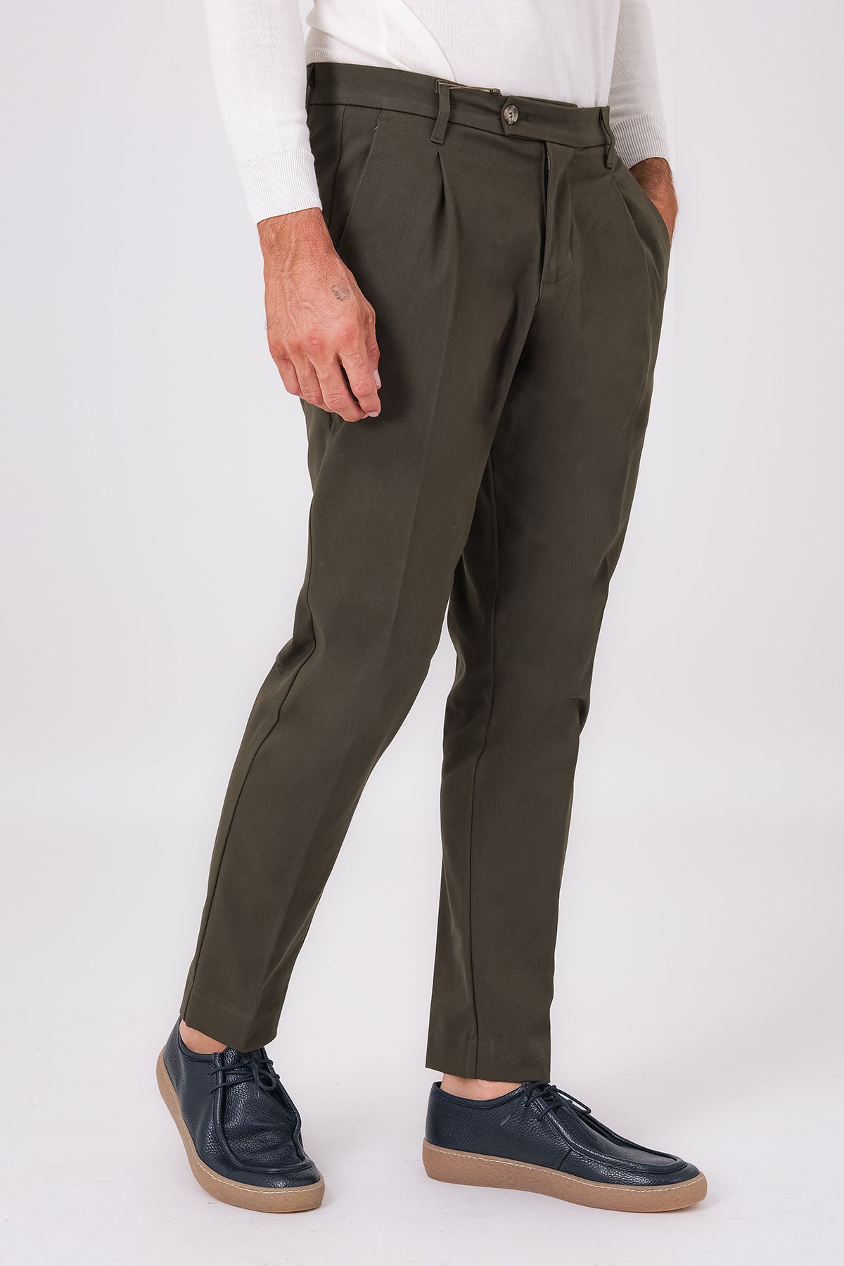 Military green stretch cotton pleated trousers on a model, front view