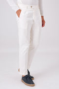 Cream stretch cotton pleated trousers on a model, three-quarter front view