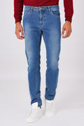 Front view of denim-blue five-pocket denim trousers on a model
