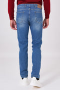 Back view of five-pocket denim trousers on a model, with patch pockets
