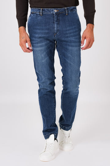 Medium-wash denim trousers with slant pockets on a model, front view