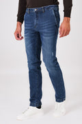 Medium-wash denim trousers with slant pockets on a model, front view
