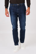 Dark denim trousers with slant pockets on a model, front view