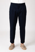 Man wearing dark blue high waist pants with darts front view