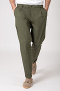 Man wearing high-waisted olive green trousers with darts front view