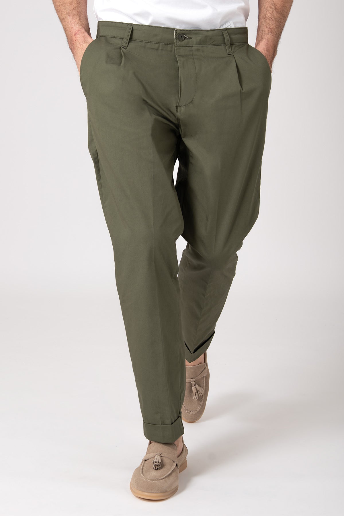 Man wearing high-waisted olive green trousers with darts front view