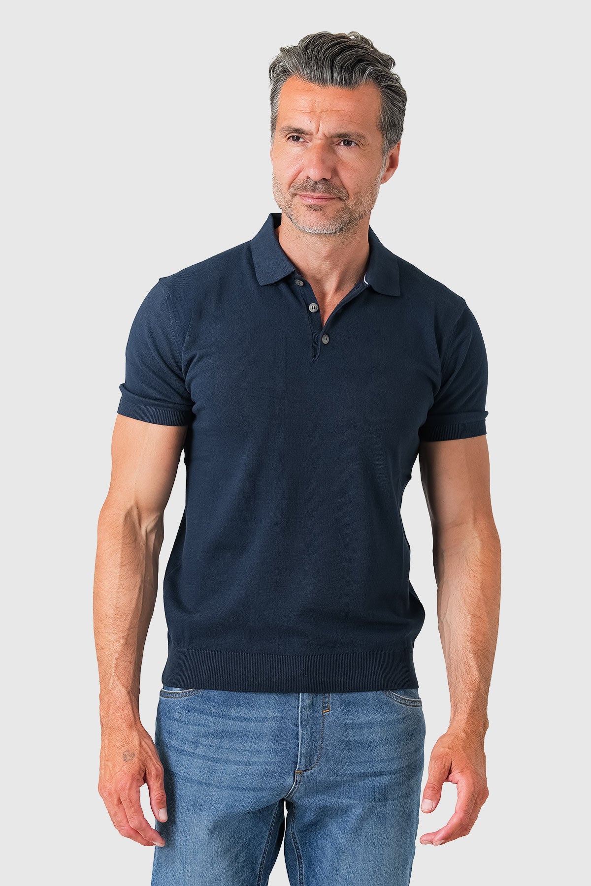 Short sleeve cotton polo in navy blue - front view