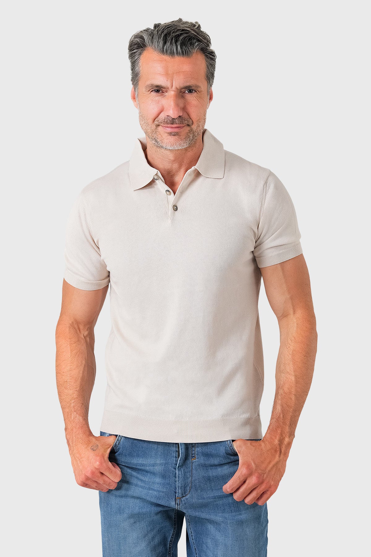 Short-sleeve cotton polo in sand color, viewed from the front