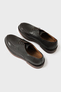 Three-quarter view from above of dark brown leather Norwegian derby shoes