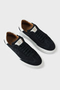 Low-top blue suede trainers with a white cupsole and lace-up front