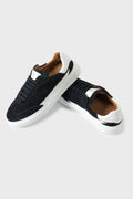Pair of blue suede trainers with contrasting white sole and details