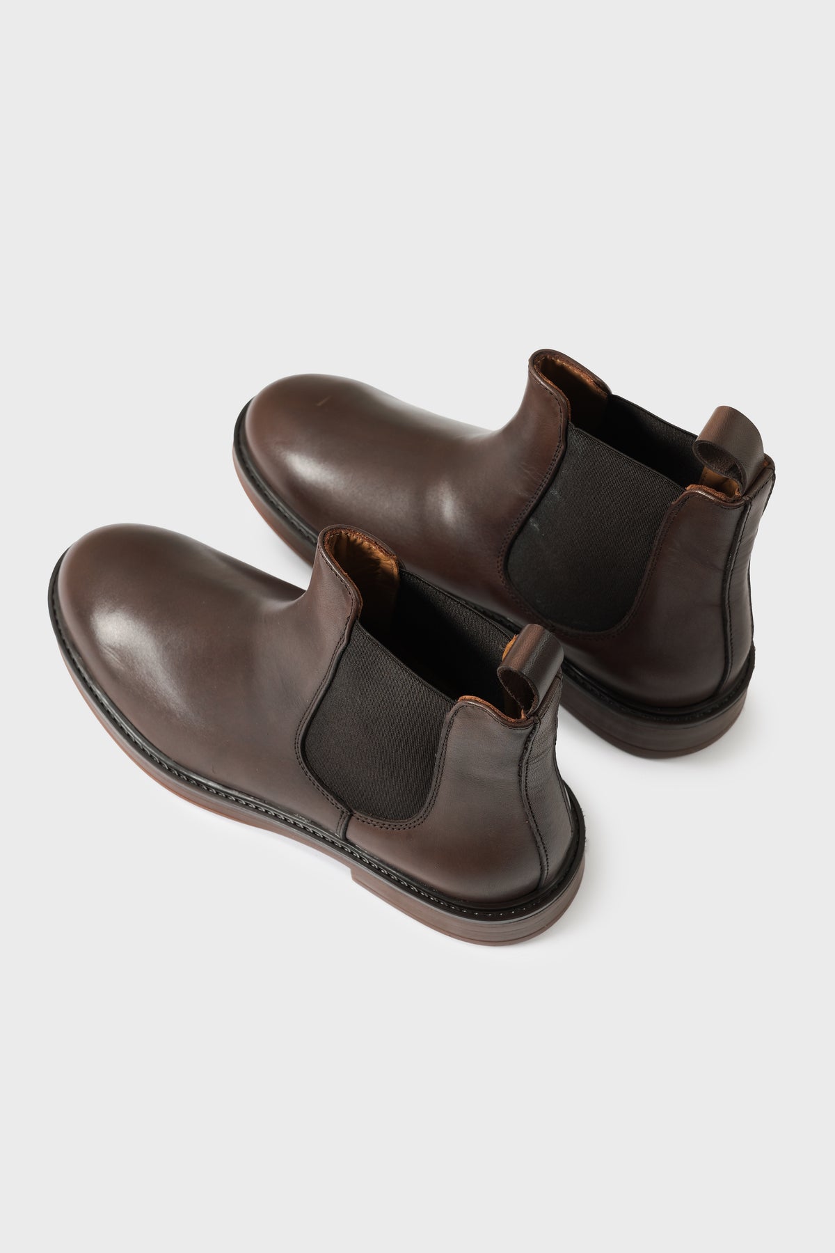 Brown leather Chelsea boots with elasticated inserts and rear pull tab