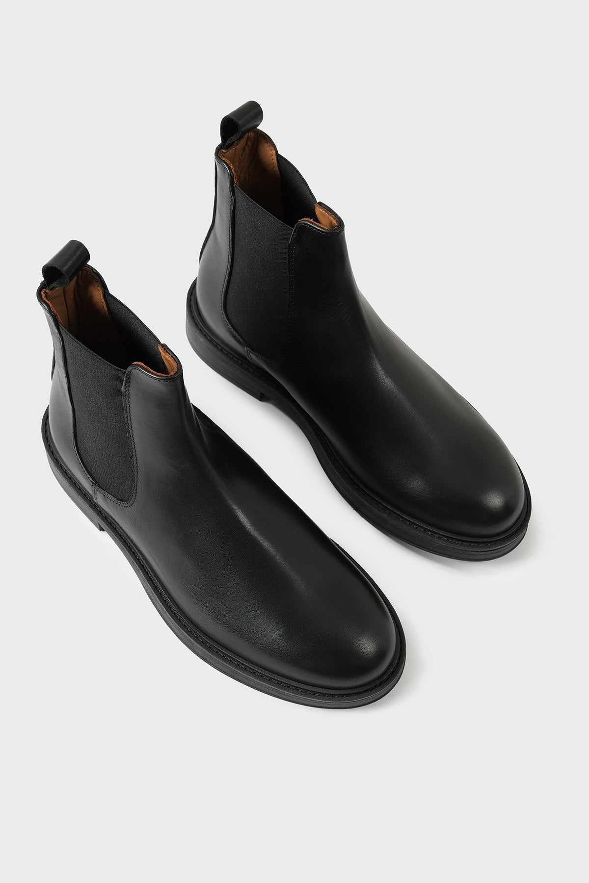 Pair of black leather Chelsea boots with elasticated side panels