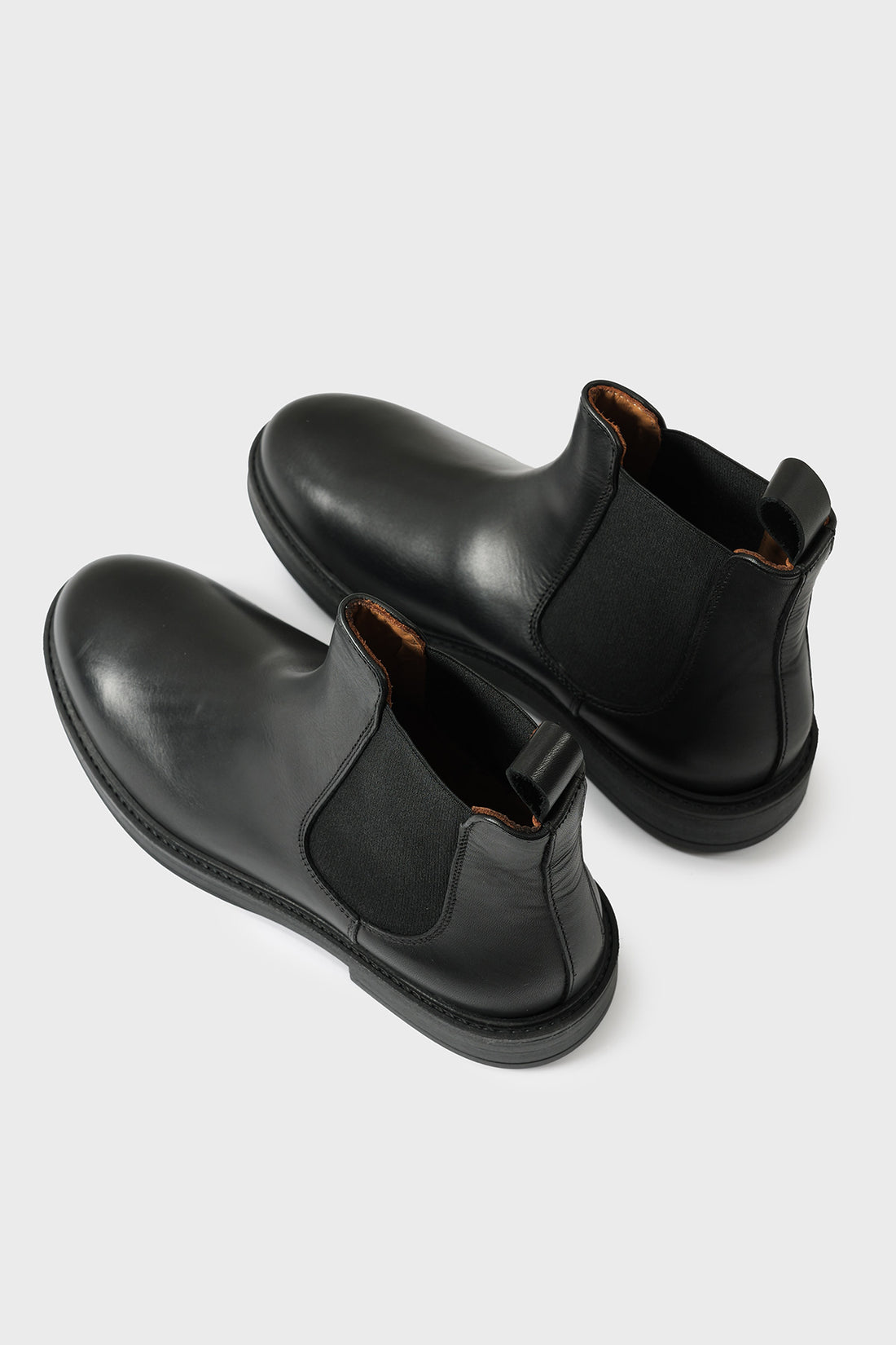 Pair of black leather Chelsea boots with elasticated side panels
