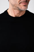 Front close-up of man wearing black mercerized cotton T-shirt