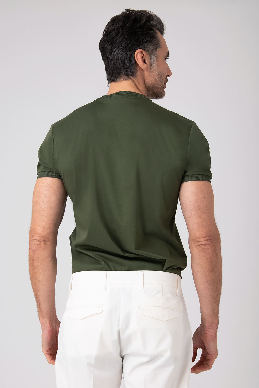 Man wearing a green mercerized cotton T-shirt front view with short sleeves and neck insert