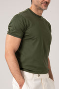 Man wearing green mercerized cotton t-shirt side view
